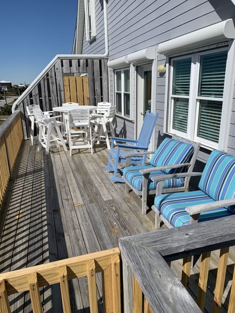Upper deck with dining table & plenty of chairs to relax and enjoy the view
