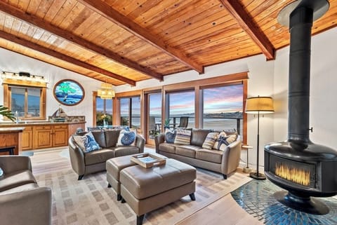 Enjoy a cozy fire with ocean views
