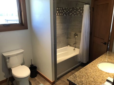 Combined shower/tub, hair dryer, towels, soap