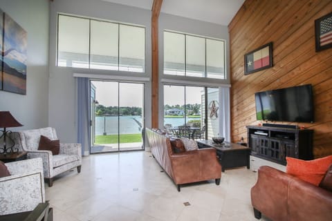 Large living area with plenty of seating and a great view of the lake.  