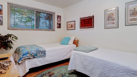 Two twin beds, a gaming tv an a huge picture window.