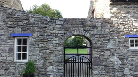 Archway leading from courtyard to Guest Cottage