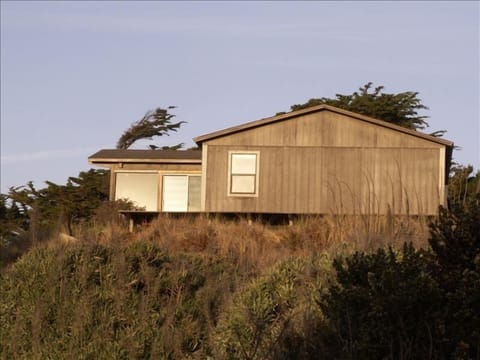 Perched on the sand dunes with views to the beach and creek.  
