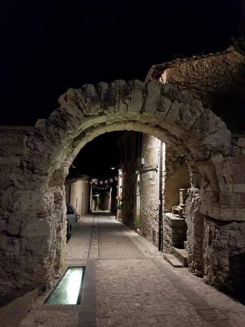 illuminated Spello arch