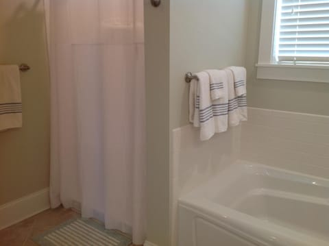 Combined shower/tub, hair dryer, towels, soap