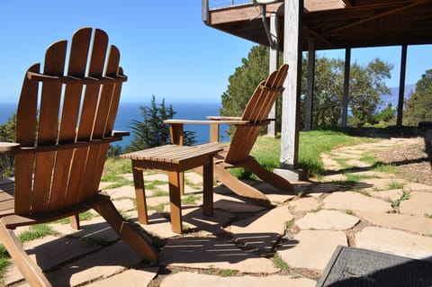 Patio area off the lower bedroom offers a place to relax and enjoy the view