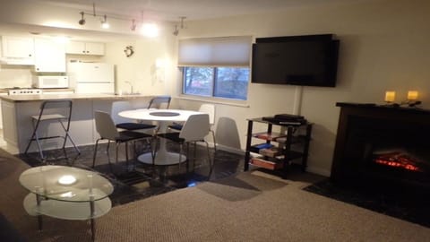 48" Smart TV w/ sound bar, Bluetooth enabled, on swivel wall mount, DVD.