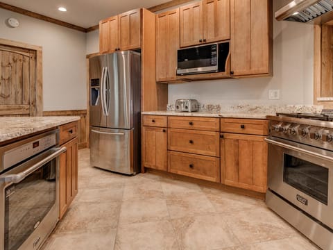 Gourmet kitchen with gas range stove and electric convection oven