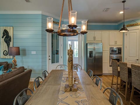 Fine wood dining table seats 10 with 4 at the bar.