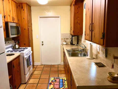 original refinished cabinets from 1957 fully stocked with cooking gear