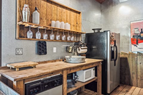 Barn kitchenette with sink, microwave, refrigerator & dishwasher