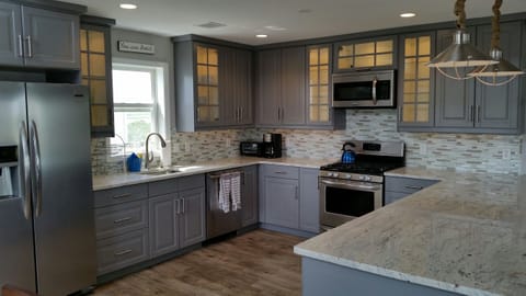 Brand new kitchen with granite counters and stainless steel sppliances