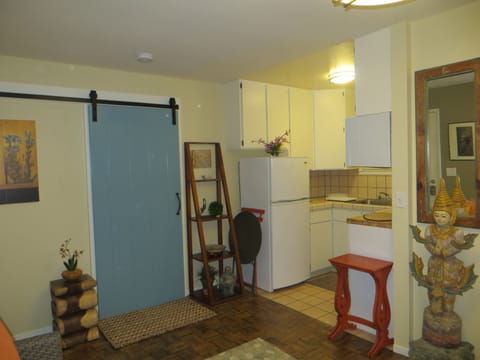 Zen Guest House, looking toward kitchenette & bedroom behind the blue barn door.