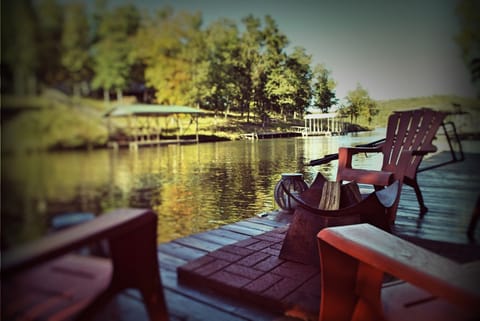 Relax in an adirondack style chair next to the firepit on the 40 ft swim deck.