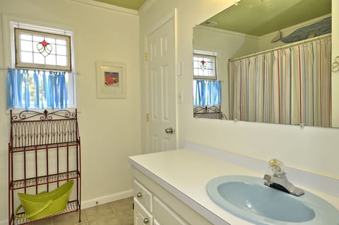 Hall bath.  Full tub with shower.  Entrances from hall and from 2nd bedroom.