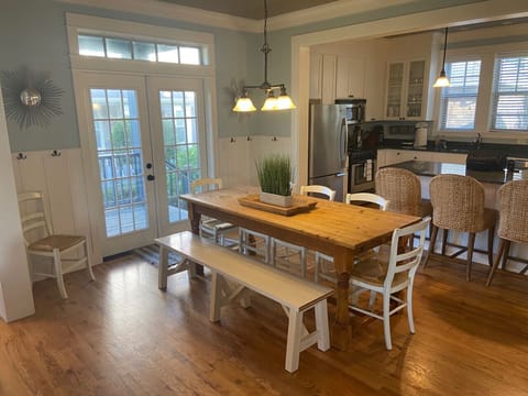 Large farmhouse table seats 8+ comfortably for family feasts, board games, and making memories.
