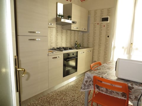 The kitchen is fully equipped with cooking tools, well-working appliances.