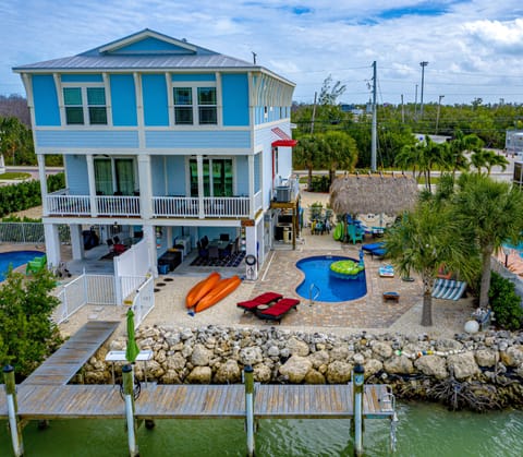 Aerial view - two kayaks, paddle boards, private pool & dock, loungers and more!