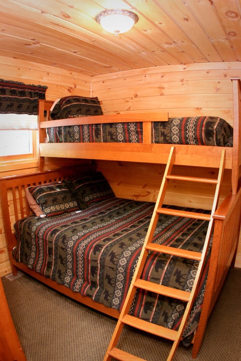 2nd bedroom with a queen bed and a twin bunk 