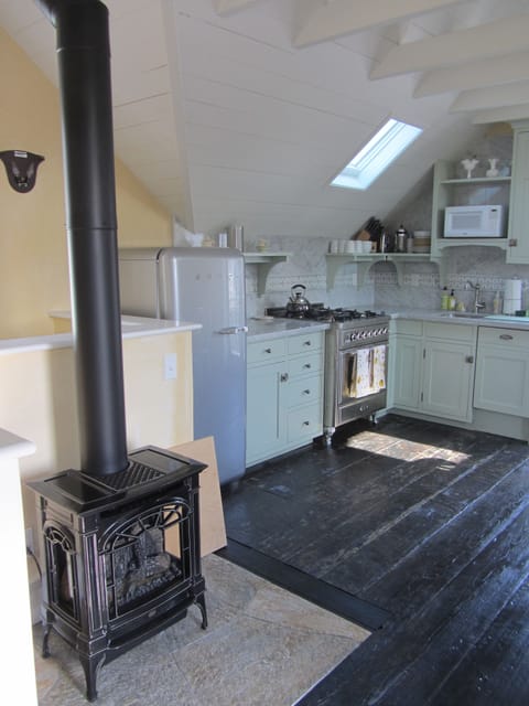 Lopi gas stove to keep things cozy during the winter, orig restored barn floors