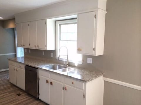 Newly painted kitchen with granite countertops 