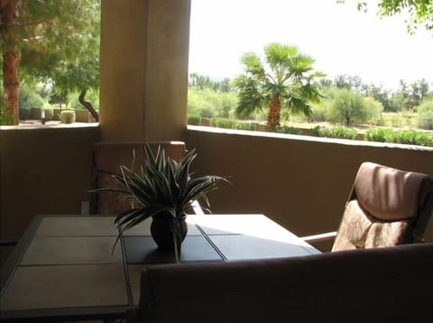 Patio with bar height patio table and chairs.