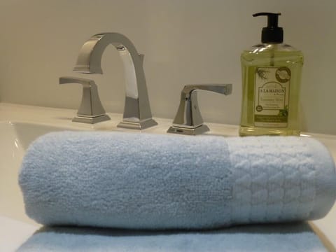 Combined shower/tub, hair dryer, towels, soap