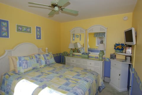 Bedroom, with  white wicker furniture , 2nd TV and  2nd air-conditioner for room