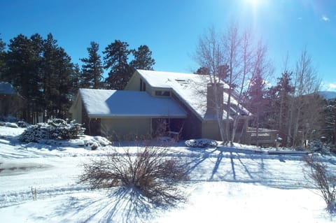 Front winter view of Evergreen Home on cul-de-sac