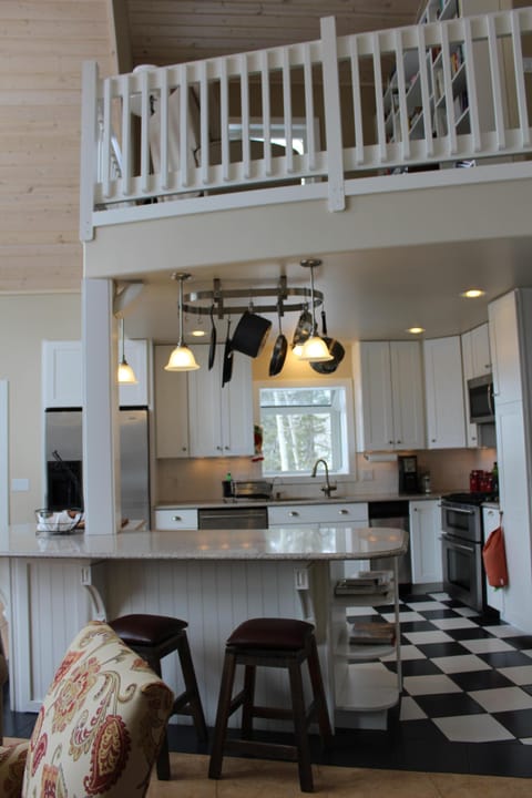 Fully stocked kitchen with upper level sitting area