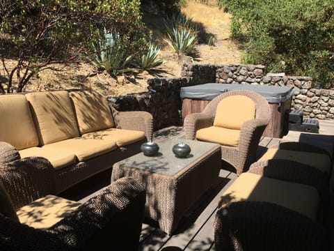 Outdoor seating area/hot tub off main house 