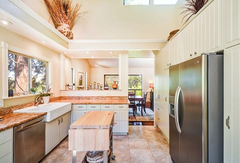 Farmhouse-style Kitchen with Dining Area beyond.