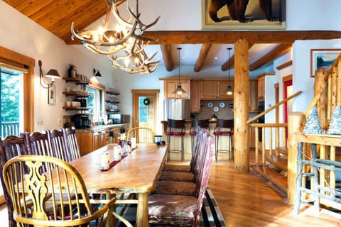 Dining table seats 10-12. The hub of the house. Views of Lone Peak.