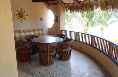 Upstairs, covered sitting area, overlooking pool. Master suite attached.