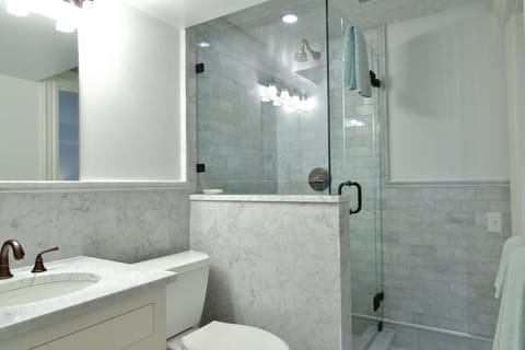 Combined shower/tub, hair dryer, towels, toilet paper