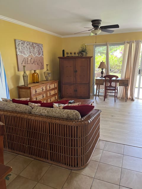 Living area, with newly installed vinyl plank flooring. Sofa bed.