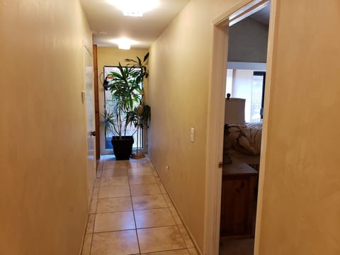 Looking from hallway, just beyond laundry room. Right Master bedroom