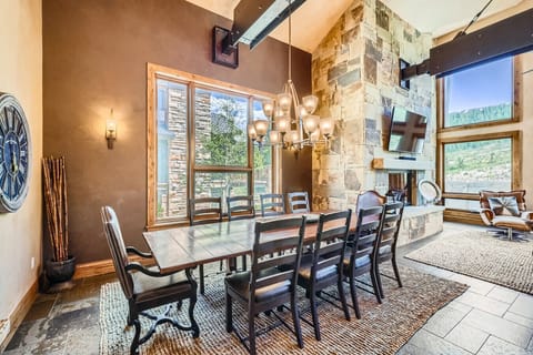 Beautiful dining area with elegant seating, offering stunning mountain views and an ideal setting for family meals.