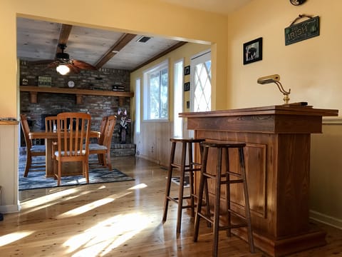 Bar area and dining room.  Living room is behind and kitchen on left.