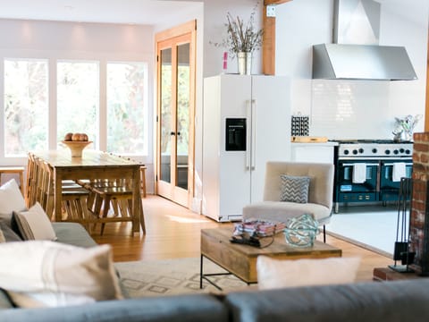 It has a wine closet & lots of seating & is adjacent to a well-equipped kitchen.