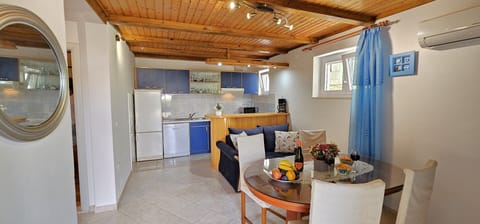 Apt Olive open plan kitchen/dining/living area