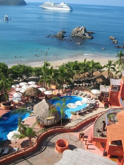 View of pool complex from stairs below restaurant