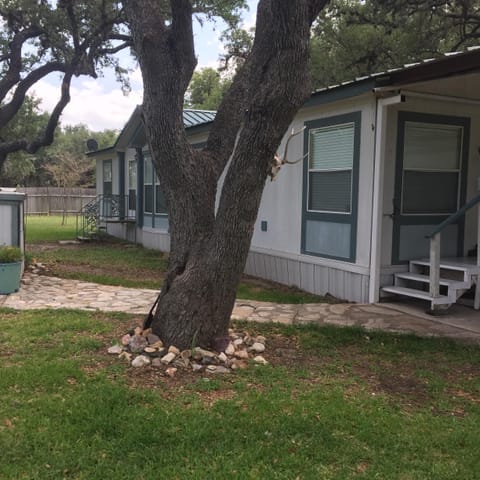 Large beautiful Oak trees provide plenty of shade on the property.