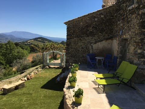 The back of the terrace and garden with Mount Ventoux in the distance