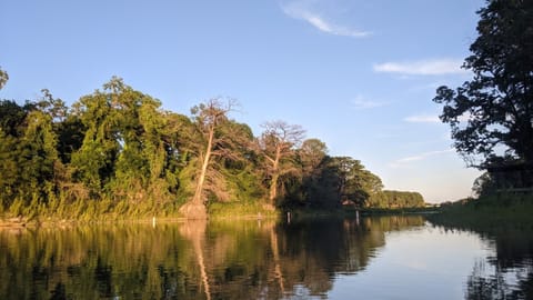 View of river from kayak at sundown