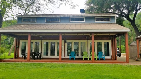 View of back of house with French doors overlooking yard