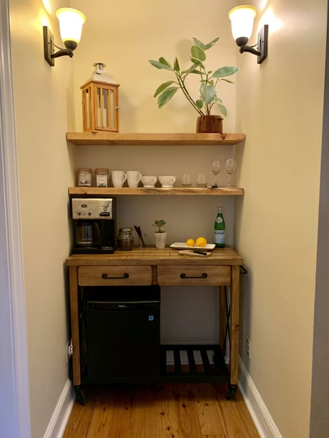 Fridge, microwave, coffee/tea maker, cookware/dishes/utensils