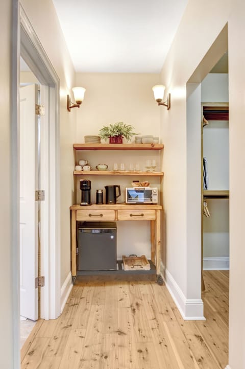 Coffee nook provides plenty of dishes, flatware and glassware. Nespresso pods are provided.