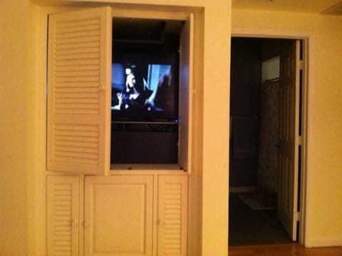 lg flat screen smart tv hidden in armoire...doors slide in or open out