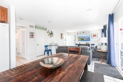 Beyond the living area is the dining area with table and seating for 6.